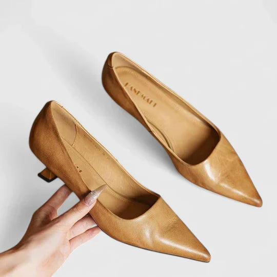 A woman in balanced comfort heels moving from the office to an evening reception.