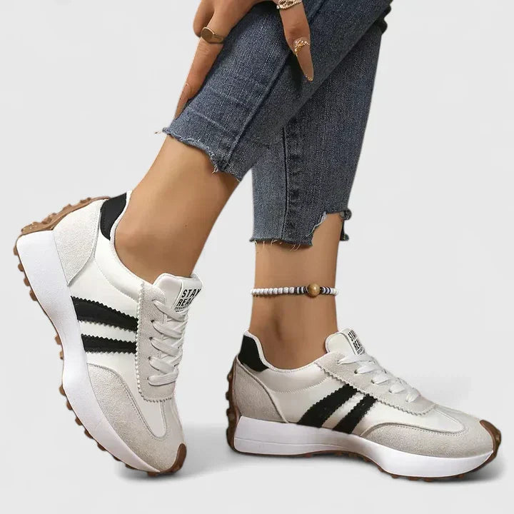 A woman wearing classic cushioned orthopaedic sneakers