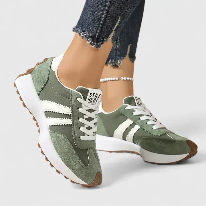 A woman wearing classic cushioned orthopaedic sneakers