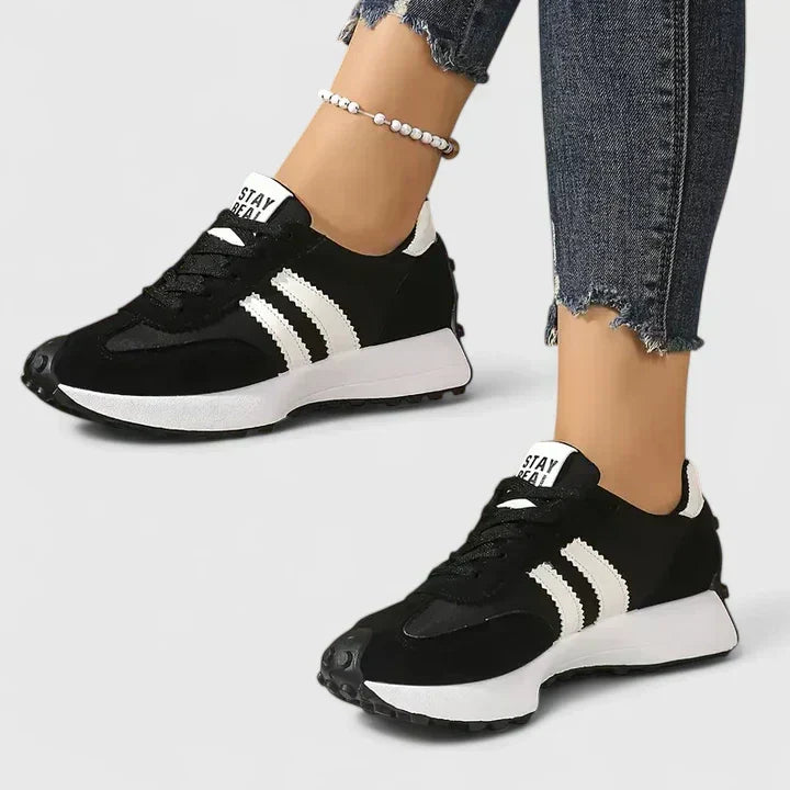 A woman wearing classic cushioned orthopaedic sneakers