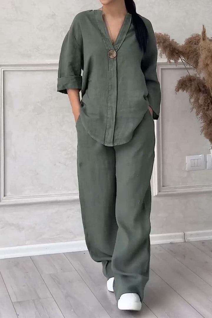 A woman wearing a loose relaxed top with matching wide-cut pants.