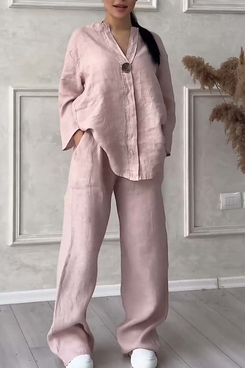 A woman wearing a loose relaxed top with matching wide-cut pants.