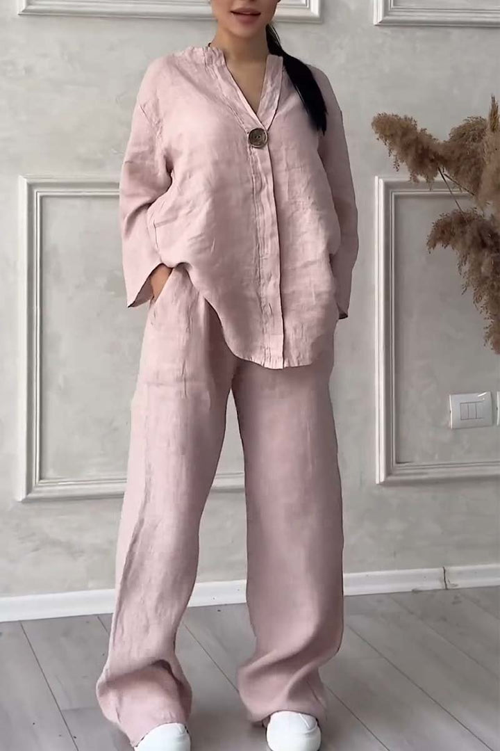 A woman wearing a loose relaxed top with matching wide-cut pants.