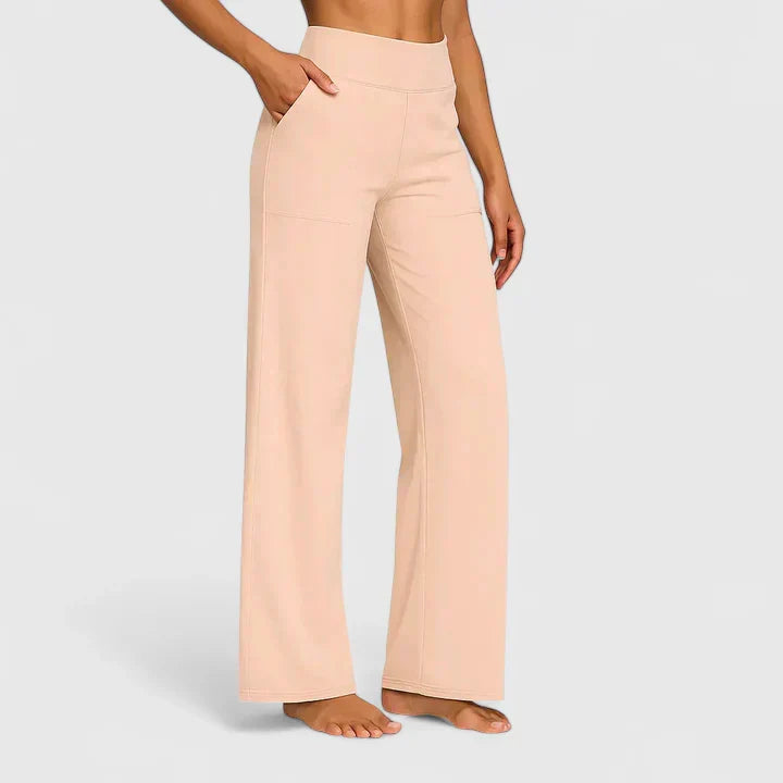 A woman in elegant straight-leg pants with pockets, styled for a polished everyday look.