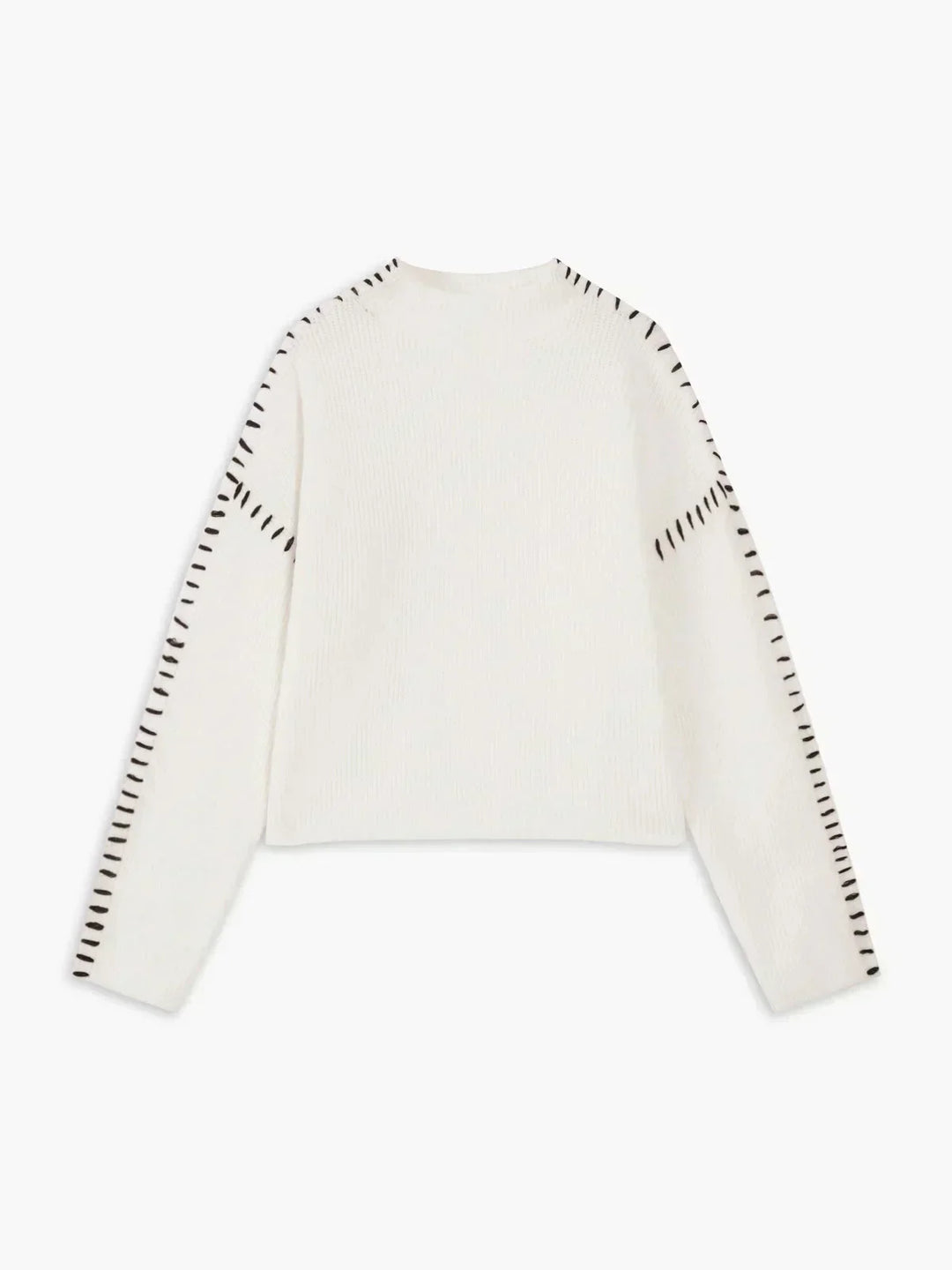 A woman wearing an oversized mock-neck sweater with whipstitch detailing, cosy and stylish.