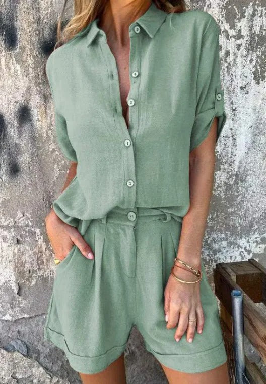 A woman in a coordinated button top and shorts set, styled for an easy sunny summer look.