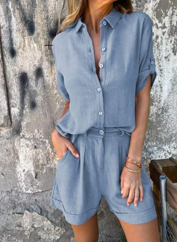 A woman in a coordinated button top and shorts set, styled for an easy sunny summer look.