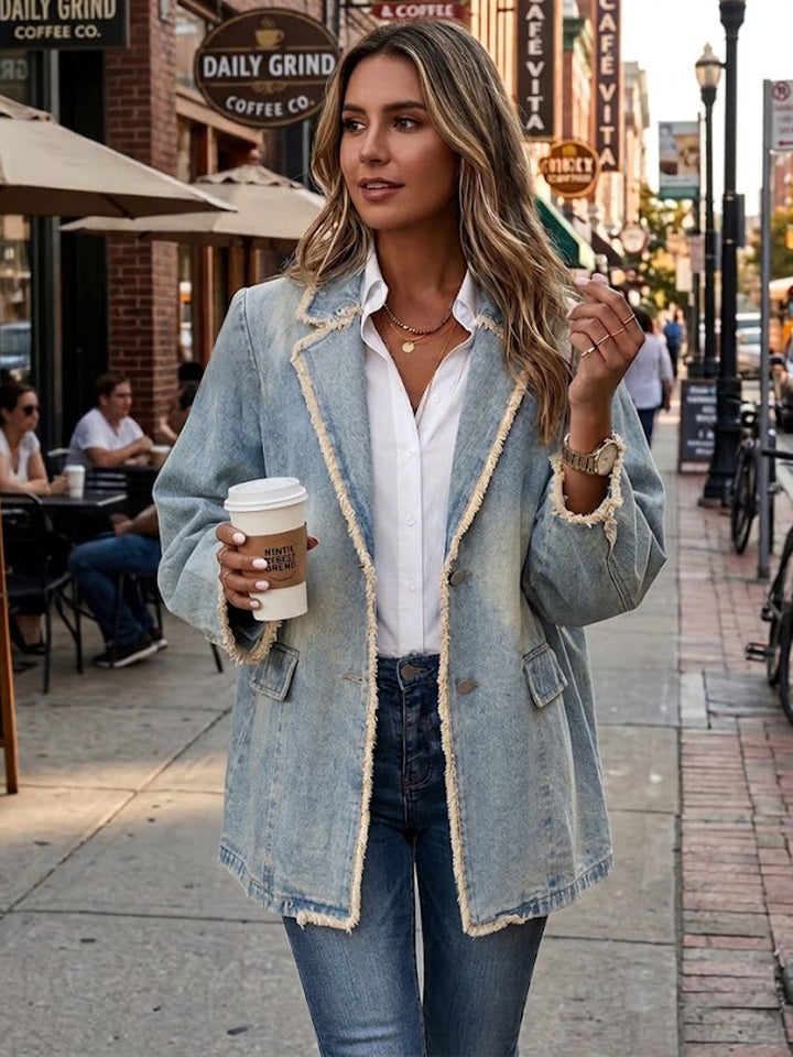 Women's oversized blazer in a pale washed look with frayed edges