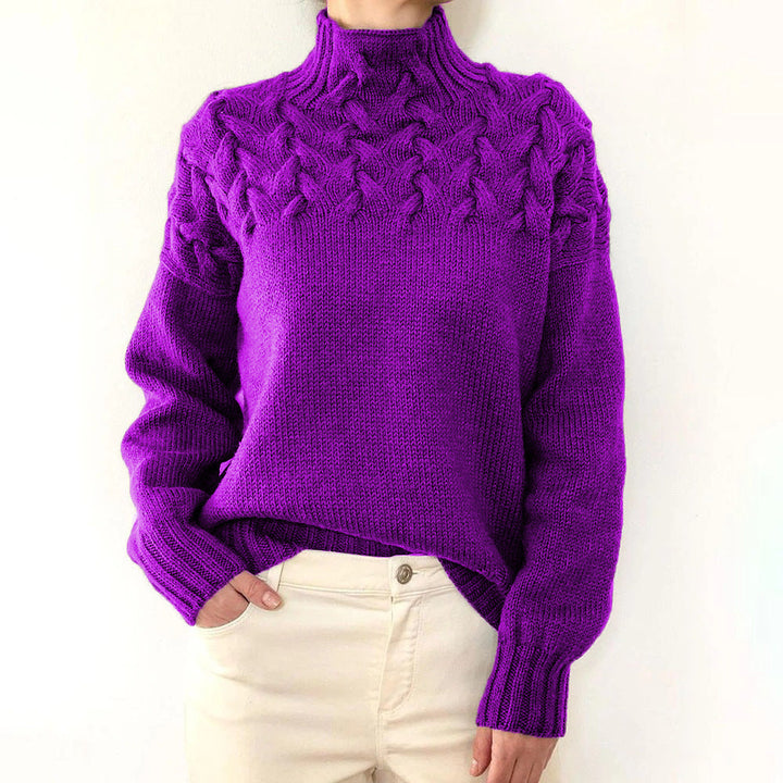 A woman wearing a warm roll-neck sweater, cosy and elegant on a cold winter day.