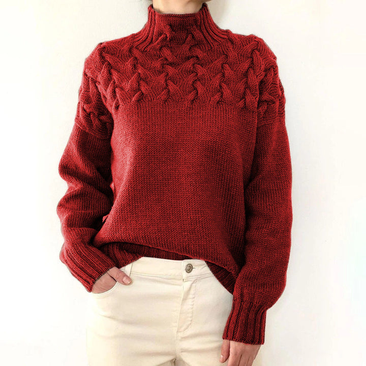 A woman wearing a warm roll-neck sweater, cosy and elegant on a cold winter day.