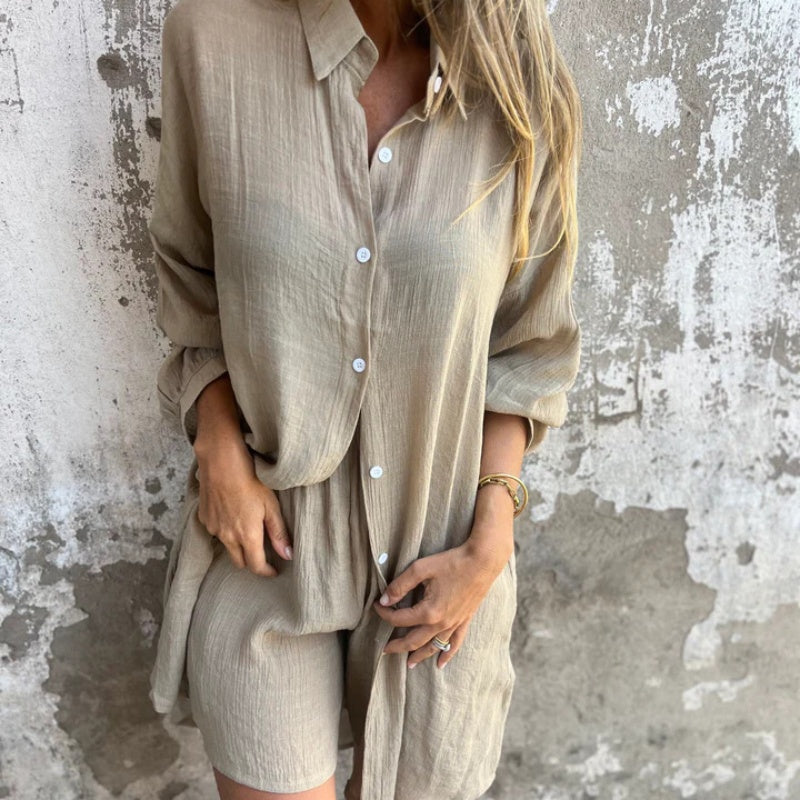 A woman wearing a relaxed beige button-front shirt with matching shorts