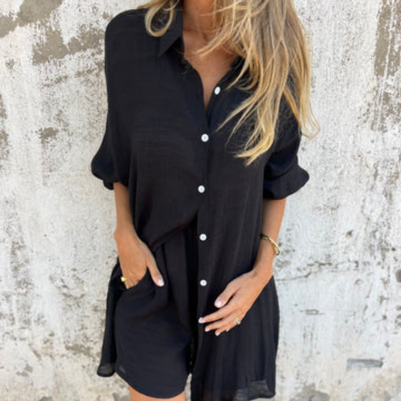 A woman wearing a relaxed beige button-front shirt with matching shorts