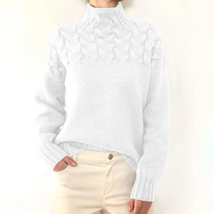 A woman wearing a warm roll-neck sweater, cosy and elegant on a cold winter day.