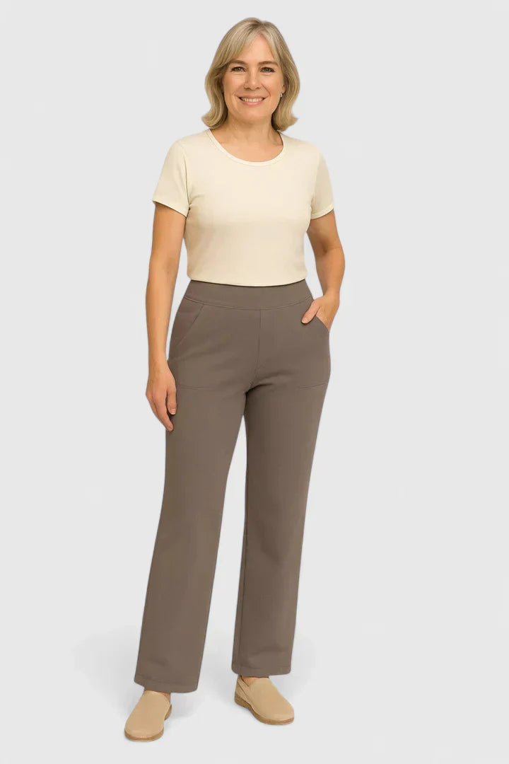 A woman in elegant straight-leg pants with pockets, styled for a polished everyday look.