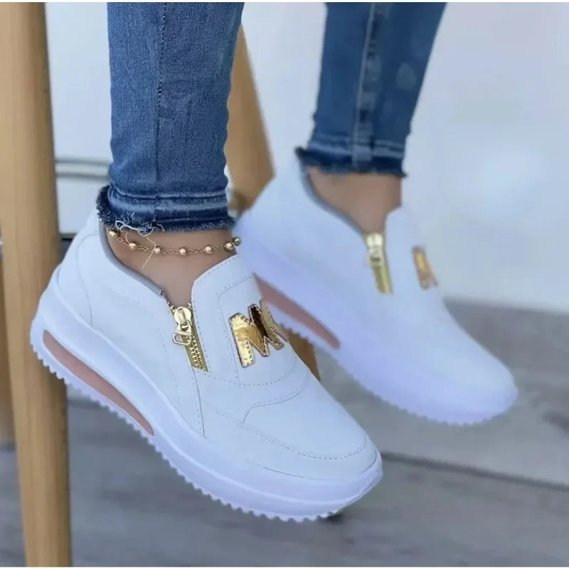 A woman wearing cushioned side-zip sneakers with a relaxed everyday outfit