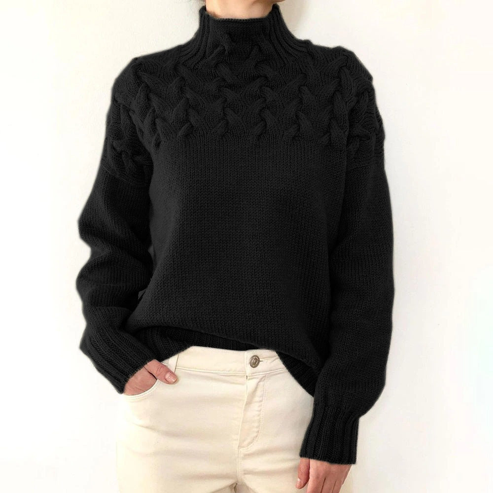 A woman wearing a warm roll-neck sweater, cosy and elegant on a cold winter day.