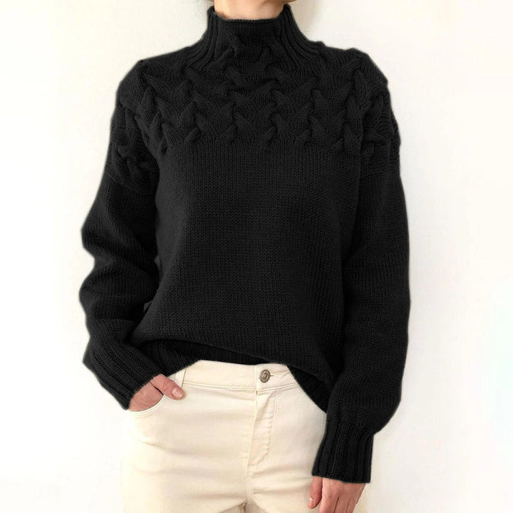 A woman wearing a warm roll-neck sweater, cosy and elegant on a cold winter day.